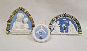 Della Robbia pottery arched shaped plaque, the Annunciation, with fluting border, 32cm wide, similar