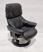 Ekornes reclining armchair in black leather, on black swivel base