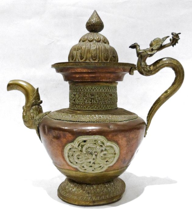 Late 19th century or later, Tibetan copper and brass fitted teapot, with Naga form handle.