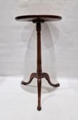 19th century mahogany circular occasional table, the dished top on turned and carved pedestal to