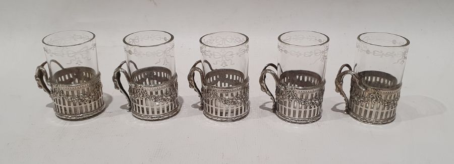 Possibly German glass shot glasses with silver mounts and handles, indistinctly marked to base (