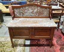 19th century washstand with galleried back and marble top, two cupboard doors, on tapering supports,