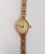 Lady's 9ct gold Rotary wristwatch, the oval dial with baton numerals and side button and the 9ct