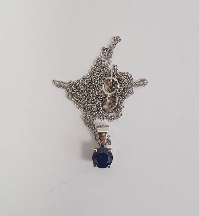 18K white gold and sapphire pendant set single circular stone and the 18K white gold fine chain link