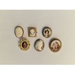 Gold-coloured metal and porcelain brooch, cherub decorated, another continental boy in cap, small