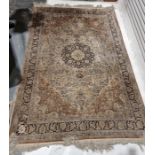 Large Chinese cream ground silk rug with central floral medallion surrounded by floral motifs