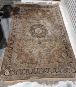 Large Chinese cream ground silk rug with central floral medallion surrounded by floral motifs