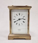 20th century five-sided glass carriage clock with roman numerals on a white face, marked 'St