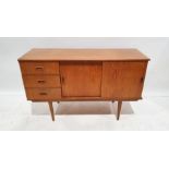 Mid century modern teak sideboard with three drawers, two sliding cupboard doors, on cylindrical