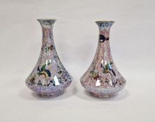 Pair Wiltonware lustre pottery vases, each with flared body and decorated with birds and flowers