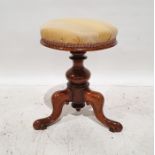 Victorian beech circular piano stool, on turned supports to three ogee legs
