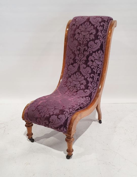 Late Victorian walnut-framed salon chair with upholstered seat, turned front legs to black china