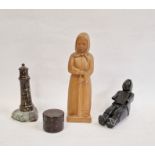 Carved black hardstone figure of Inuit, indistinctly marked to foot, two carved stone lighthouses, a