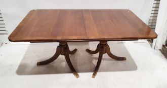 20th century Regency-style dining table, the rectangular top with rounded corners, moulded edge,