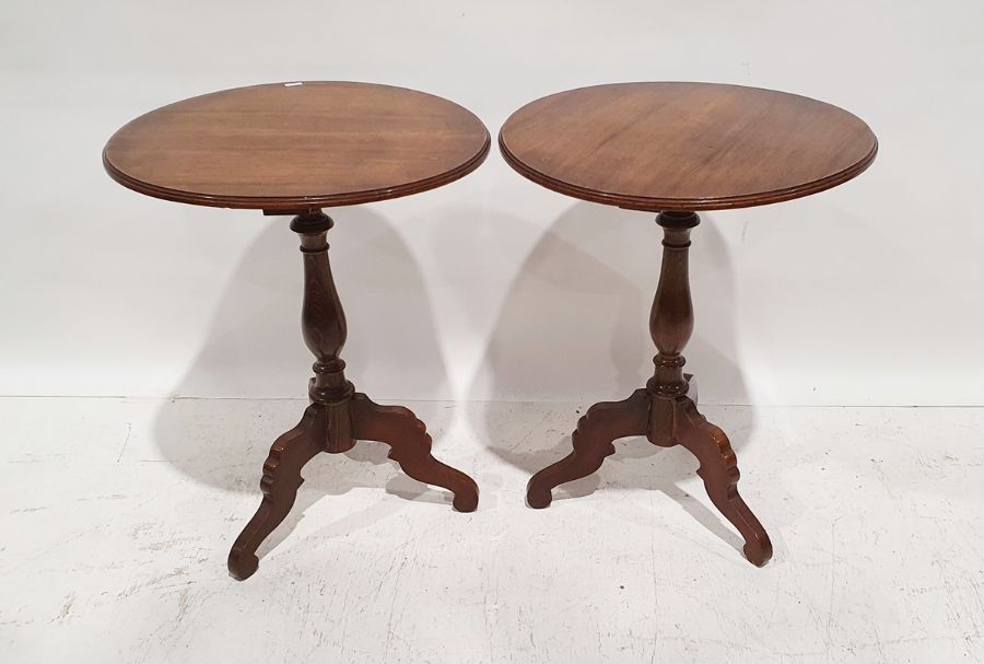 Pair of 20th century mahogany occasional tables with moulded edges, on baluster turned supports to