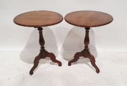 Pair of 20th century mahogany occasional tables with moulded edges, on baluster turned supports to