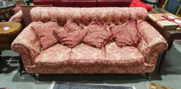 Victorian button-back Chesterfield three-seater settee in pink floral brocade and on turned bun feet