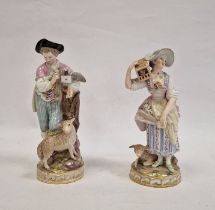 Pair Meissen figures, the lady holding letter, bird in cage on her shoulder and lamb at her feet,