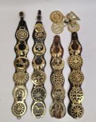 Assorted horse brasses included brass horse brasses mounted on four leather straps