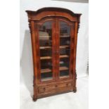 19th century continental glazed mahogany cabinet, the moulded cornice above domed top, the two