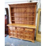 20th century pine dresser, with moulded cornice, open shelves, three drawers, three cupboard