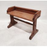 Victorian gothic-style pine bench on carved end supports