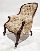 Early Victorian armchair with mahogany frame and yellow button-back upholstery, serpentine front,