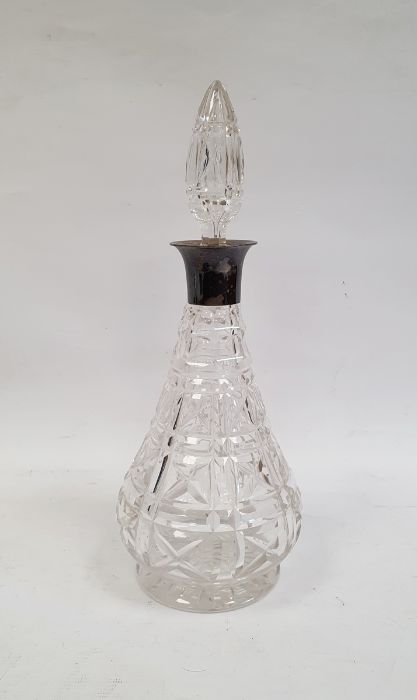 Cut glass baluster-shaped decanter with silver collar and glass stopper