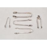 Five assorted sugar tongs to include Edward VII sugar tongs with bright cut decoration, London