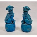 Pair Chinese turquoise glazed Buddhist lions each on a circular drum base, 20cm high