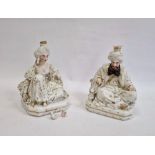 Pair Continental porcelain scent bottle candle holders each of seated figure of an Eastern couple,