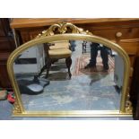 20th century overmantel mirror with arched top in gilt-effect frame, 90cm x 128cm