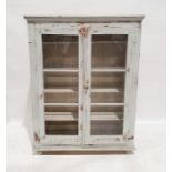 Vintage shabby chic-style glazed cabinet, the moulded cornice above two glazed doors enclosing