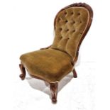 Victorian nursing chair with mahogany frame, mustard upholstered seat and back, on cabriole front