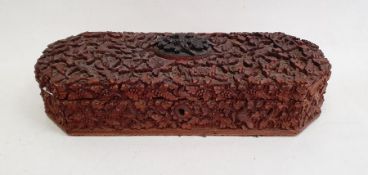 Eastern carved hardwood box with hinged lid and red velvet interior (29 x 6.5 x 11 cm)