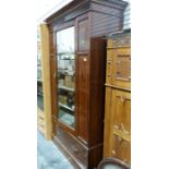 Late 19th/early 20th century single-door wardrobe by Maple and Co, in mahogany, the moulded