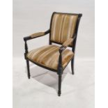 Early 20th century armchair in gold striped upholstered back, seat and arms, on wrythen turned and