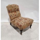 Early Victorian low nursing chair with upholstered seat and back, ebonised and turned front legs