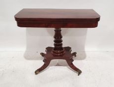 Regency-style mahogany tea table, the rectangular top with rounded front corners and banded, on a