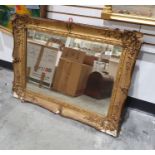 Rectangular mirror in moulded gilt-effect frame, 64cm x 84cm
