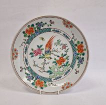 Oriental porcelain plate, polychrome decorated with exotic bird on paeony branches to the centre,