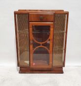 20th century walnut display cabinet in the Art Deco manner, single drawer above glazed door, glass