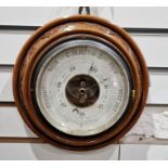 Circular barometer in turned and carved case, 21cm diameter