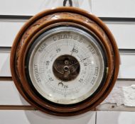 Circular barometer in turned and carved case, 21cm diameter