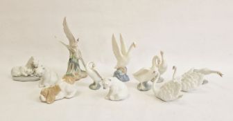 Lladro polar bear family group, two other Lladro model polar bears, two Lladro swans, two Lladro