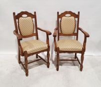 Pair of modern oak framed armchairs with yellow upholstered seats and backs, on turned front legs (