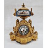 19th century French ormolu and porcelain mantel clock with striking movement ,with foliate finial