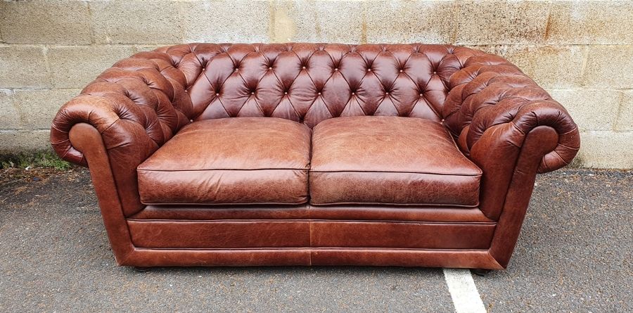 Modern two-seater brown leather Chesterfield sofa  Condition ReportSome light surface marks and