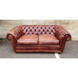 Modern two-seater brown leather Chesterfield sofa  Condition ReportSome light surface marks and