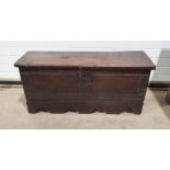Possibly 18th century or earlier sword chest, the top marked 'TH' with stylised rose decoration,